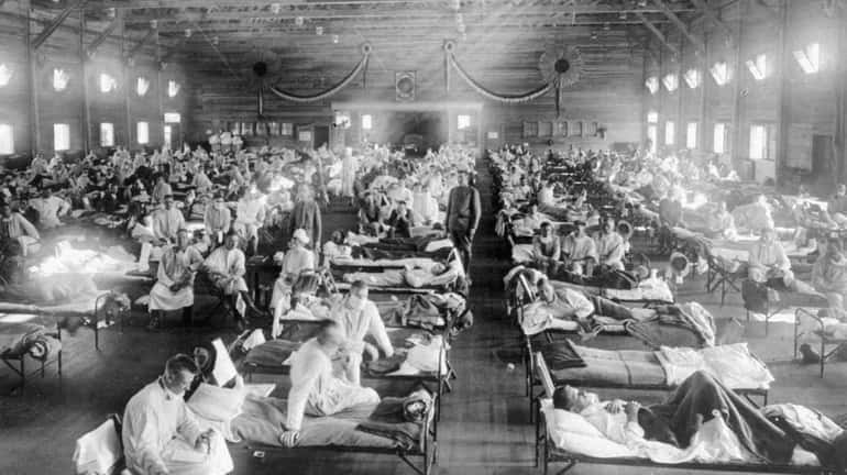 Patients in an emergency hospital in Camp Funston, Kansas, during...