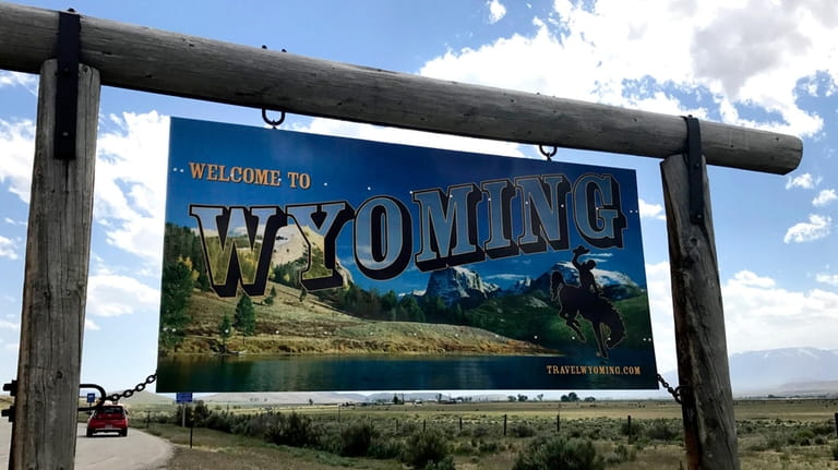 A sign on the border of Wyoming and Montana appears...