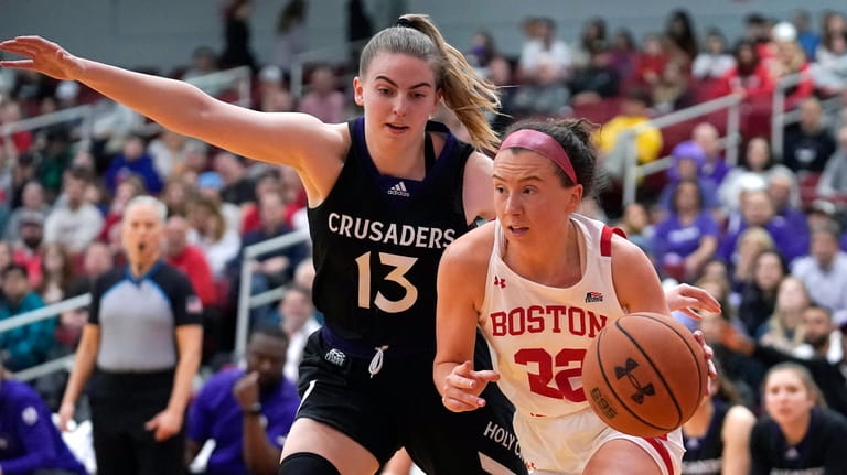 Holy Cross guard Bronagh Power-Cassidy (13) defends as Boston University...