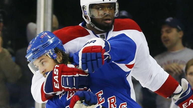 P.K. Subban #76 of the Montreal Canadiens grabs Mats Zuccarello...