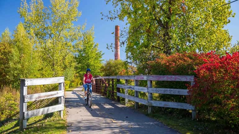 Cyclist rides the rail trails through Keene, NH. 