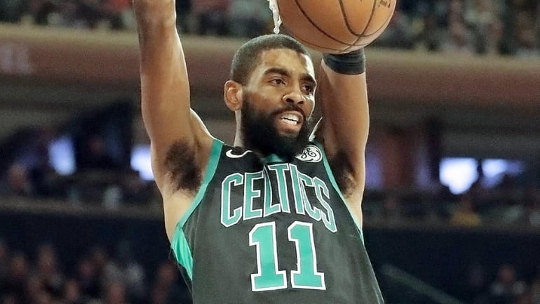 Celtics guard Kyrie Irving dunks against the Knicks at Madison...