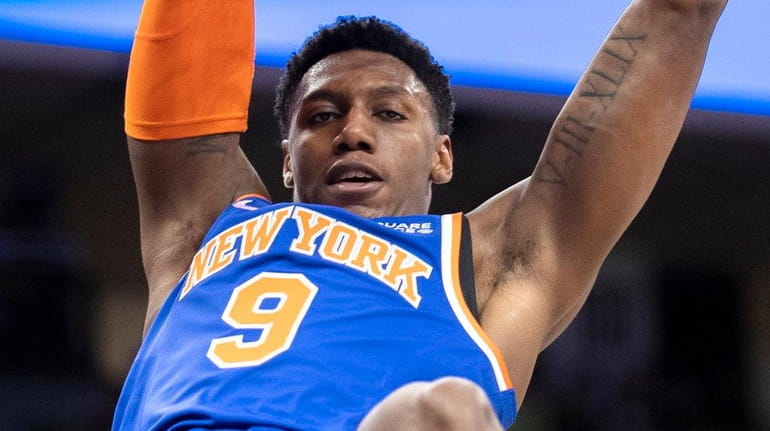 Knicks guard RJ Barrett scores off a dunk in the...
