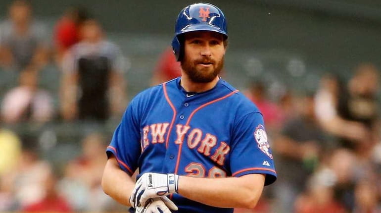 Daniel Murphy of the New York Mets stands on second...