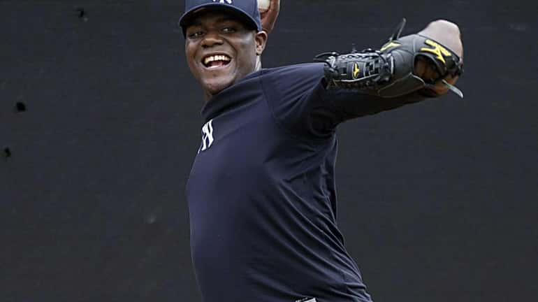 Michael Pineda delivers a pitch in the bullpen during the...