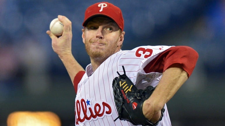 Roy Halladay of the Phillies delivers against the Marlins at...