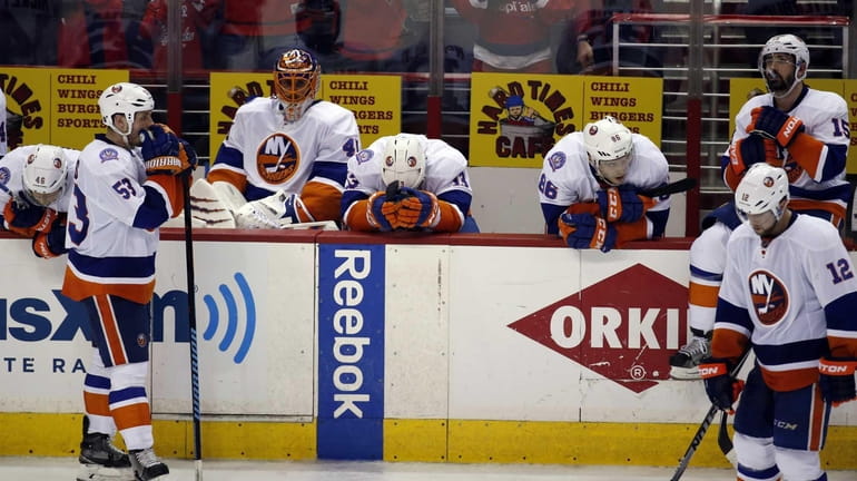 The New York Islanders react after Game 7 in the...