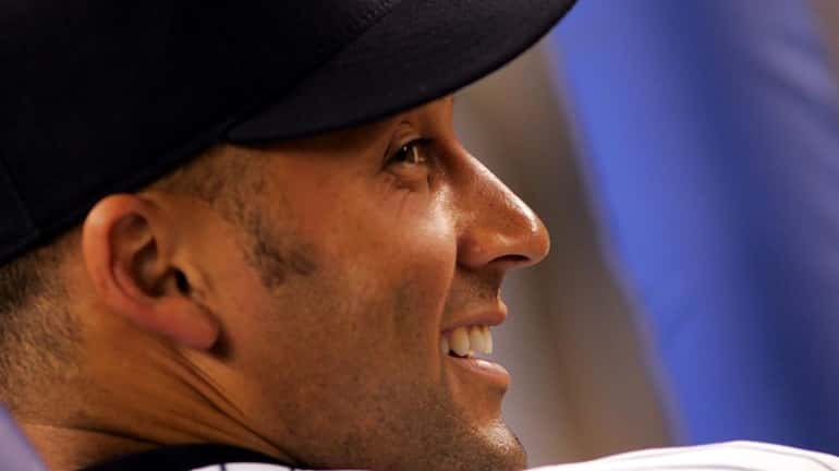 Derek Jeter in the Yankees dugout as at Yankee Stadium...