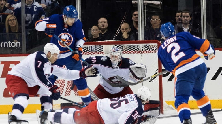 New York Islanders defenseman Nick Leddy (2) scores a goal...