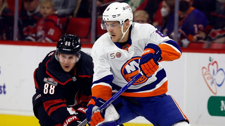 New York Islanders' Ryan Pulock (6) controls the puck in...