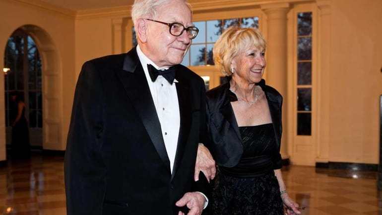Billionaire Warren Buffet visits the White House with his wife,...