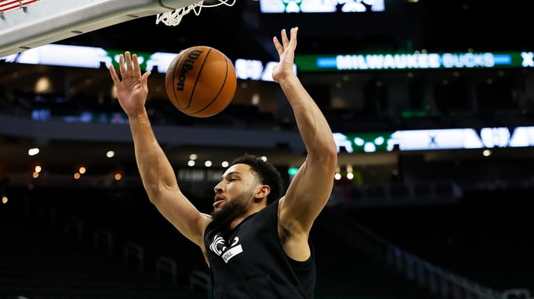 Ben Simmons #10 of the Brooklyn Nets warms up before...