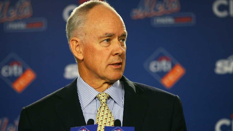 Sandy Alderson answers questions during a press conference after being...
