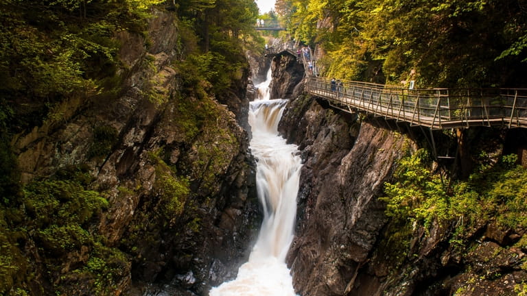 A beautiful scenery of High Falls Gorge surrounded by dense...