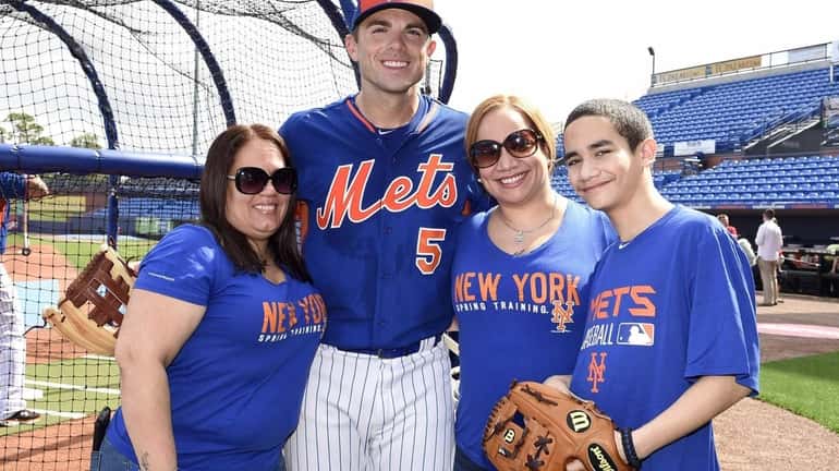 In this photo provided by the New York Mets, New...