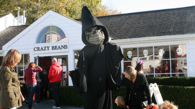 Monster Merlin leads the Halloween parade at the Stony Brook...