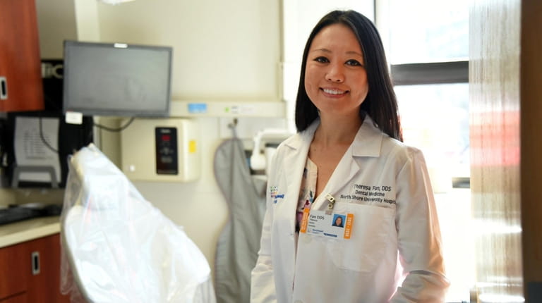 Dr. Theresa Fan, a dentist at Northwell, in a patient...