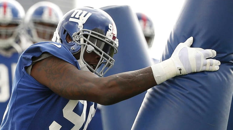 New York Giants defensive end Jason Pierre-Paul works out during...