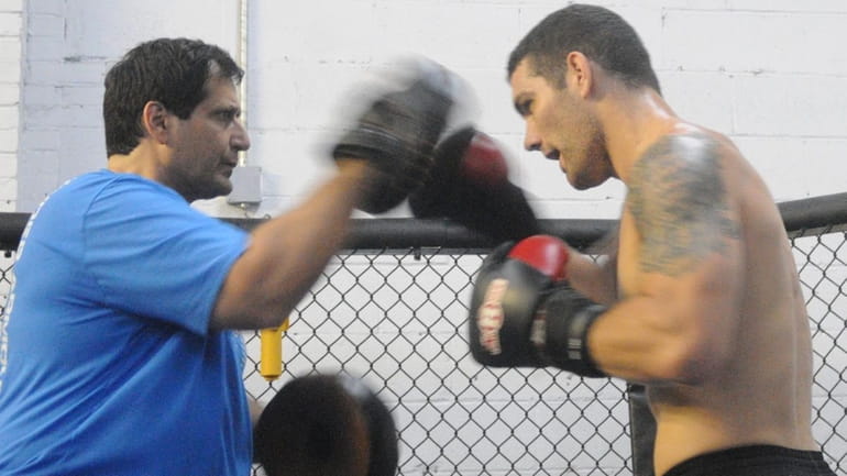 Middleweight Chris Weidman, 26, of Baldwin, trains with Ray Longo...