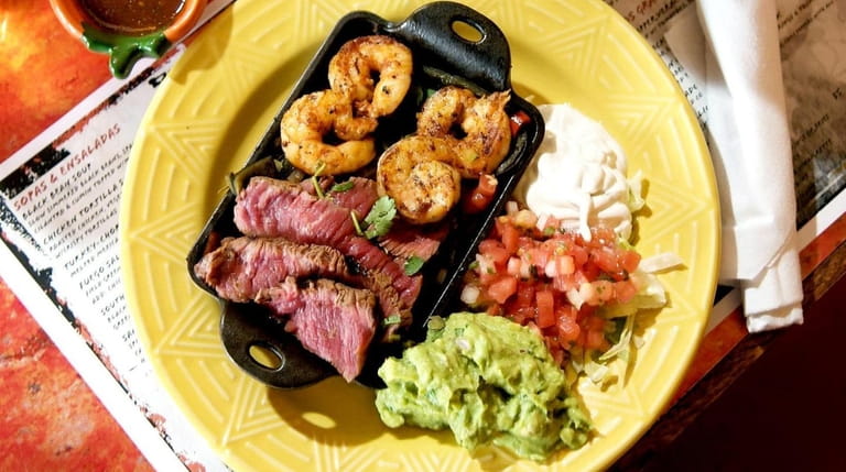 Del Fuego's platter of surf and turf fajitas — beef and...