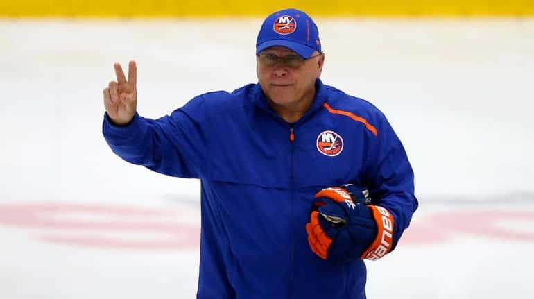 Islanders head coach Barry Trotz skates during summer training camp at...