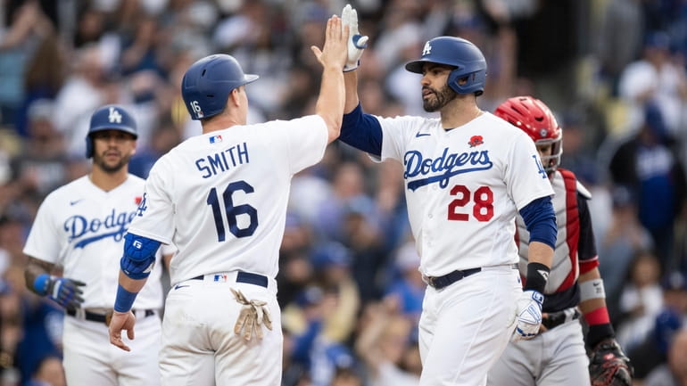 Los Angeles Dodgers designated hitter J.D. Martinez (28) celebrates after...