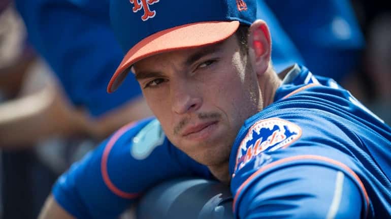New York Mets pitcher Steven Matz looks on from the...