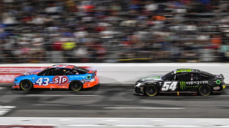Erik Jones (43) and Ty Gibbs (54) compete during the...