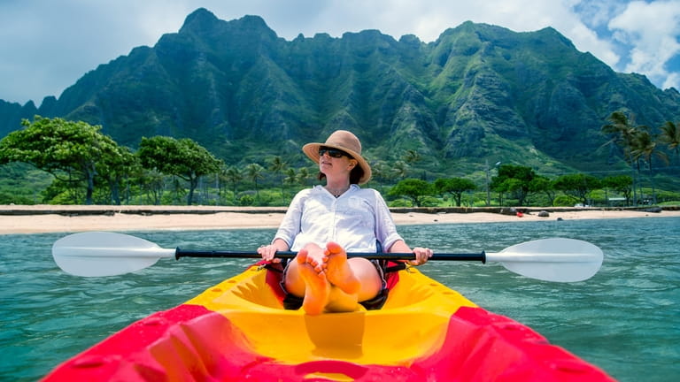 A woman kayaking in Oahu, Hawaii.