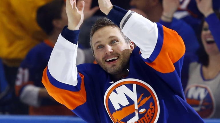 Lubomir Visnovsky #11 of the New York Islanders reacts with...