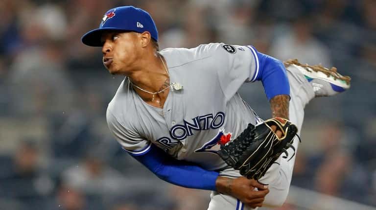 Marcus Stroman of the Blue Jays pitches against the Yankees...