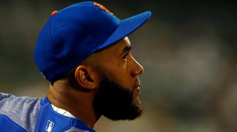 Mets shortstop Amed Rosario looks on against the Reds at...