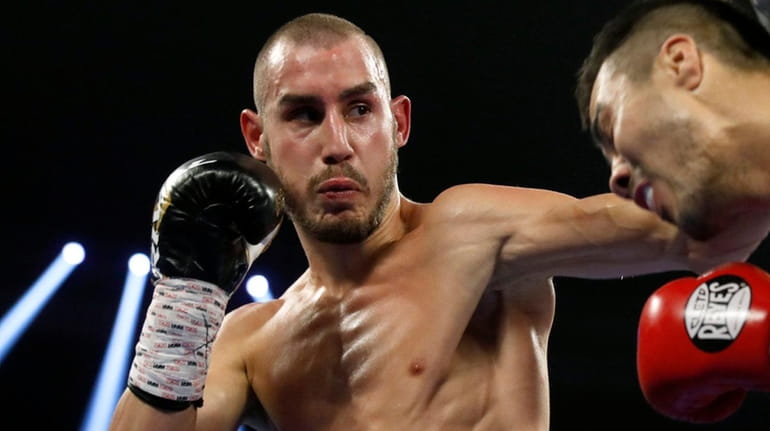 Maxim Dadashev, left, fights Antonio de Marco during a super-lightweight...