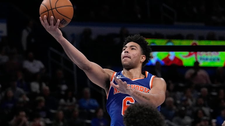 Knicks guard Quentin Grimes (6) goes up for a shot...