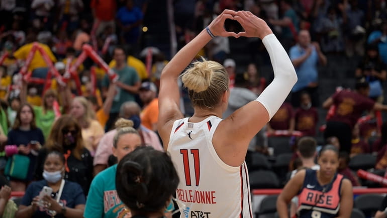 Mystics forward Elena Delle Donne gestures to the crowd after...