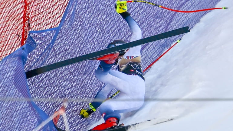Norway's Aleksander Aamodt Kilde falls during an alpine ski, men's...