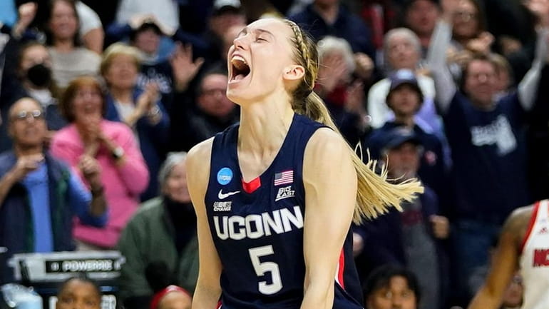 Connecticut guard Paige Bueckers (5) reacts in double overtime against...