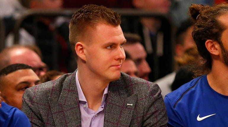 Kristaps Porzingis on the Knicks' bench during a game against...