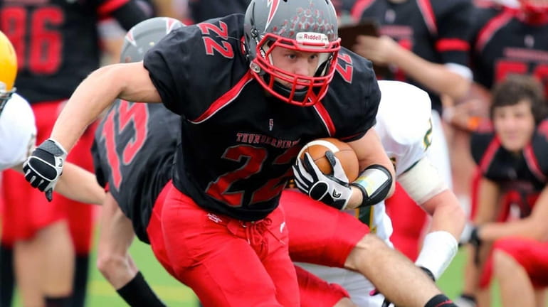 Connetquot's Ryan Harvey drives toward the goal line in the...