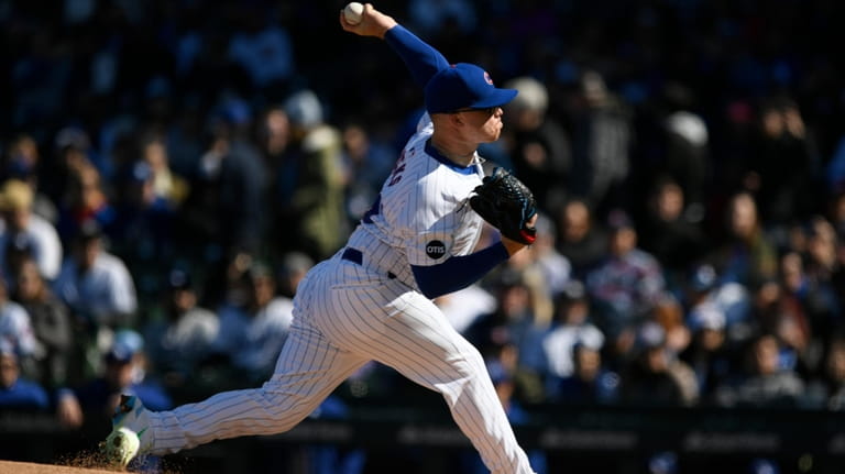 Chicago Cubs starter Jordan Wicks delivers a pitch during the...
