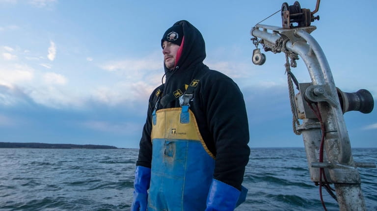 Capt. Matthew Ketcham, owner of Peconic Bay Oysters, surveys the...