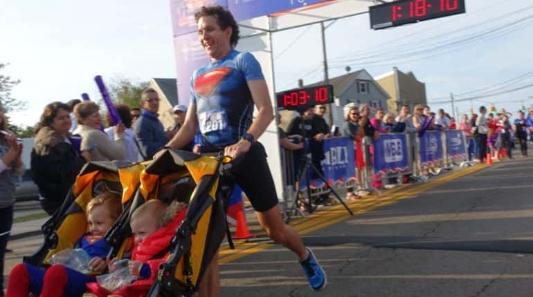 Chris Solarz, of Manhattan, breaks a Guinness World Record as...
