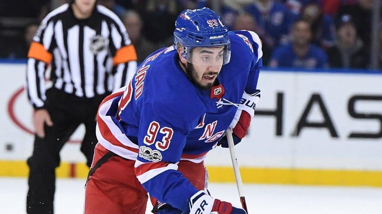 Rangers center Mika Zibanejad skates with the puck during a...