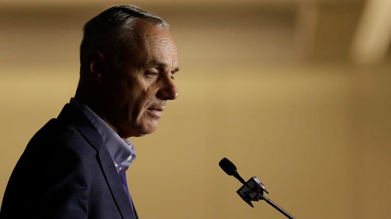 Commissioner Rob Manfred speaks during the Major League Baseball winter...