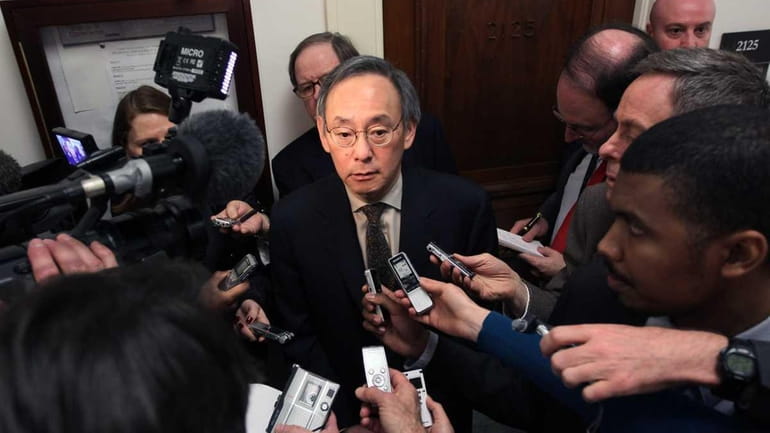 Energy Secretary Steven Chu talks with reporters after testifing at...