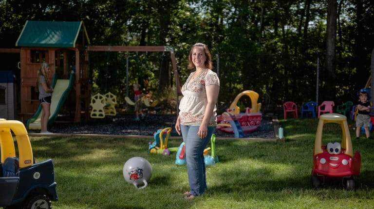 Michele Kessler, pictured at her home-based day care center in Bayport, applied...