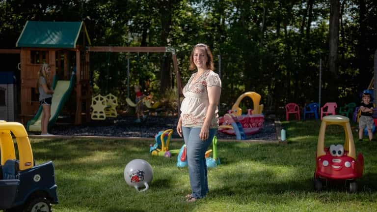 Michele Kessler, pictured at her home-based day care center in Bayport, applied...
