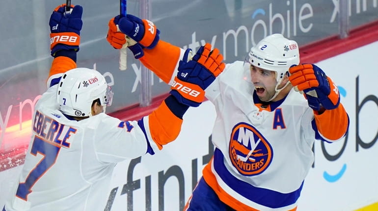 The Islanders' Nick Leddy, right, and Jordan Eberle celebrate after...