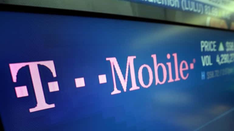 In this Feb. 14, 2018, photo, the logo for T-Mobile...