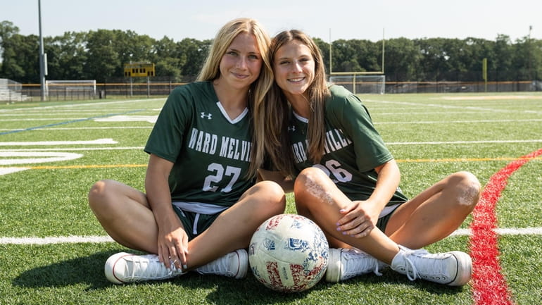 Sisters Peyton, left and Maddie  Costello of Ward Melville pose for...